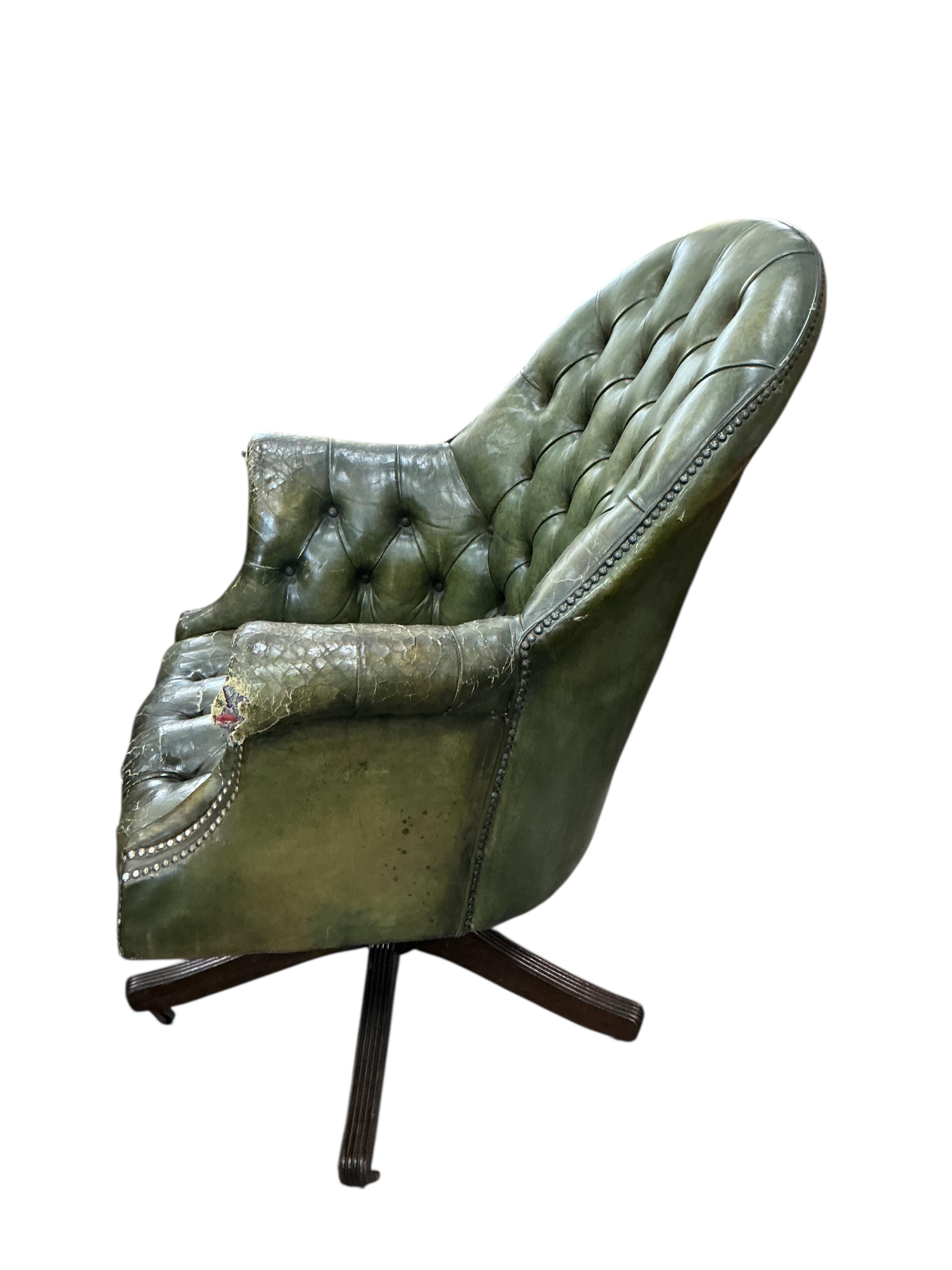 A reproduction George III style mahogany pedestal partners desk, width 180cm, depth 120cm, height 76cm, together with a button green leather swivel desk chair